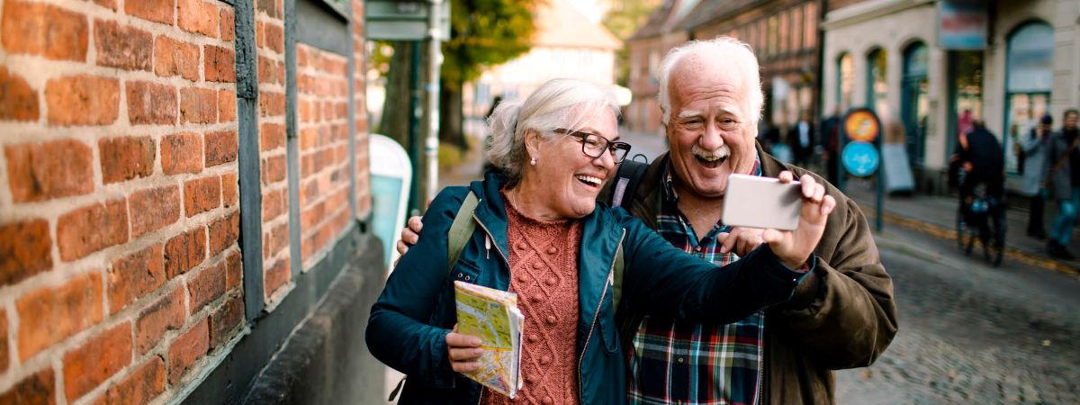 Elderly couple looking at phone